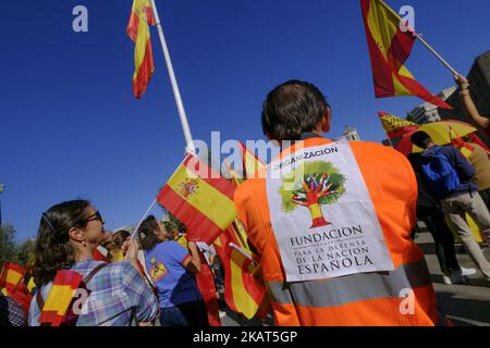 Pro-Spain demonstrators wave Spanish national flags in Colon Square during a protest for Spanish unity in Madrid, Spain, on Saturday, Oct. 28, 2017. The regional economy of Catalan, which accounts for about a fifth of Spanish gross domestic product, is under threat as more companies up sticks amid the threat of civil unrest (Photo by Oscar Gonzalez/NurPhoto) Stock Photo