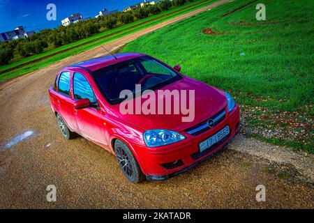 my red opel corsa c in winter or opel classic 2005 i changed the front and headlights to opel corsa c 2006 Stock Photo