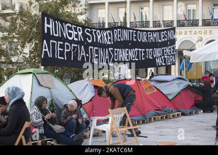 Syrian refugees are protesting for almost 2 weeks with a hunger strike and staying in tents in front of the Hellenic parlianment in Athens, Greece, on 16 November 2017 as they request from the authorities to respect the legal limit of six months for family reunification. Refugees are demanding to be reunited with their families in northwest Europe like Germany or Sweden. The settlement is between the Greek parliament and over the daily overcrowded Syntagma Square and metro station. (Photo by Nicolas Economou/NurPhoto) Stock Photo