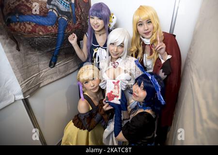 Adult film actresses pose for the cameras at the "Japan Adult Expo 2014