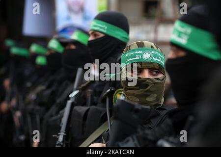 Palestinian militants from the armed Palestinian military wings attend a military march marking the 5th death of Ahmed Jabari, the late leader of the Ezz-Al Din Al Qassam Brigades, the armed wing of Palestinian Hamas movement, near his house in the east of Gaza City. 14 November 2017.Ahmed Jabari was killed in an Israeli air strike in 14 November 2012. (Photo by Majdi Fathi/NurPhoto) Stock Photo