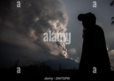 The morning of Mount Agung eruption was seen at Muncan Village on 28 November 2017 in Karangasem regency, Bali, Indonesia. Great volcanic activity in lifting back to level IV by volcanology center and geological hazard mitigation (PVMBG). Lava cool down quickly, bali service in closed temporarily due to the impact of the eruption of volcano Agung. (Photo by Muhammad Fauzy/NurPhoto) Stock Photo