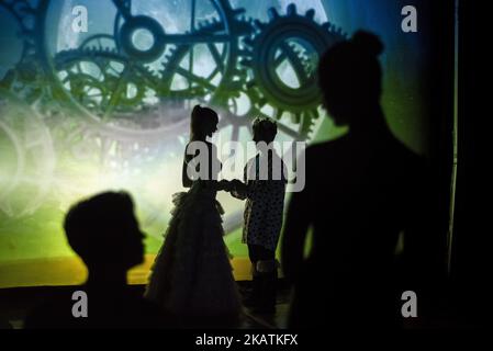 Artists of Teulis Shadow Theater during the performance in Kiev, Ukraine, on December 3, 2017. Artists of the theater create performances using the flexibility and plasticity of their own body. (Photo by Oleksandr Rupeta/NurPhoto) Stock Photo