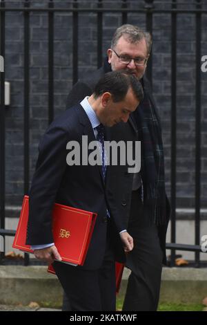 Attorney General Jeremy Wright (L), and Scotland Secretary David Mundell leave following the weekly cabinet meeting at Downing Street on December 5, 2017 in London, England. British Prime Minister Theresa May was forced to pull out of a deal with Brussels yesterday after the Democratic Unionist Party (DUP) said it would not accept terms which see Northern Ireland treated differently from the rest of the UK. (Photo by Alberto Pezzali/NurPhoto) Stock Photo