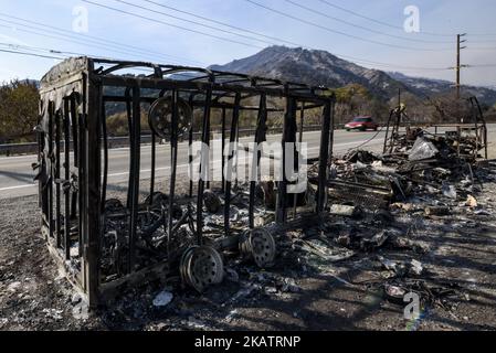 A burned-out truck and trailer are seen after the Thomas wildfire swept through Ojai, California on December 9, 2017. The wind-fueled fire burned through an area of 240 square miles, destroyed hundreds of homes and prompted massive mandatory evacuations. (Photo by Ronen Tivony/NurPhoto) Stock Photo