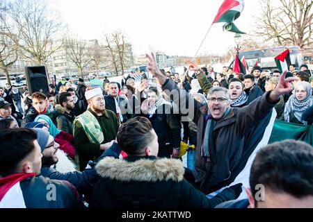 After the President of America Donald Trump has appointed Jerusalem as Capital of Israel and to announce the preparations to move the US embassy from Tel Aviv to Jerusalem, the Palestine community in The Netherlands announced on 12 December 2017 a massive demonstration in The Hague where the American Embassy is situated. Around 200 people gathered to protest and show their support to Palestine. There was some tension when some of the protesters trying to demonstrated in front of the American Embassy, but the police and also the rest of the protesters kept things in calm. (Photo by Romy Arroyo  Stock Photo