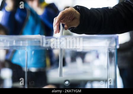 People voting with his ballot during the 21D Catalan election of 2017, on December 21, 2017 in Barcelona, Sant Cugat, Spain. (Photo by Xavier Bonilla/NurPhoto) Stock Photo