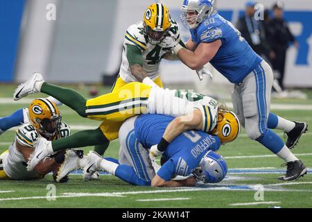 Detroit Lions quarterback Matthew Stafford (9) is tackled by Green Bay Packers outside linebacker Clay Matthews (52) during the first half of an NFL football game in Detroit, Michigan USA, on Sunday, December 31, 2017. (Photo by Jorge Lemus/NurPhoto) Stock Photo
