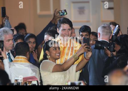 Canadian Prime Minister Justin Trudeau poses for a selfie with a young Tamil woman during the Federal Liberal Caucus Thai Pongal and Tamil Heritage Month Reception held in Scarborough, Ontario, Canada, on January 16, 2018. The Canadian Parliament officially declared the month of January as Tamil Heritage Month in 2016. Canada is home to one of the largest Tamil diasporas in the world and it is estimated that over 300,000 Tamils call Canada home. (Photo by Creative Touch Imaging Ltd./NurPhoto) Stock Photo