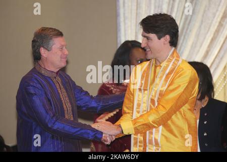 Canadian Prime Minister Justin Trudeau (right) shakes hands with Toronto Mayor John Tory (left) during the Federal Liberal Caucus Thai Pongal and Tamil Heritage Month Reception held in Scarborough, Ontario, Canada, on January 16, 2018. The Canadian Parliament officially declared the month of January as Tamil Heritage Month in 2016. Canada is home to one of the largest Tamil diasporas in the world and it is estimated that over 300,000 Tamils call Canada home. (Photo by Creative Touch Imaging Ltd./NurPhoto) Stock Photo
