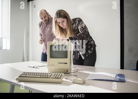 Members of staff show Macintosh 128K, signed by Steve Wozniak, release date January 1984, at MacPaw's Ukrainian Apple Museum in Kiev, Ukraine on January 26, 2017. Ukrainian developer MacPaw has opened Apple hardware museum at the company’s office in Kiev. The collection has more than 70 original Macintosh models dated from 1981 to 2017. (Photo by Oleksandr Rupeta/NurPhoto) Stock Photo