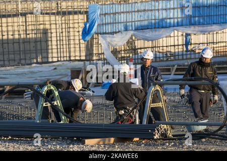 Men work at the construction site for the Tokyo 2020 venue 'Canoe Slalom Course' in Tokyo on February 6, 2018. The new facility will host Canoe (Slalom) during the 2020 Tokyo Olympic Games. Tokyo Metropolitan Government (TMG) 'Tokyo 2020 Venues Media Tour' to explain updated progress of the constructions. (Photo by Alessandro Di Ciommo/NurPhoto) Stock Photo