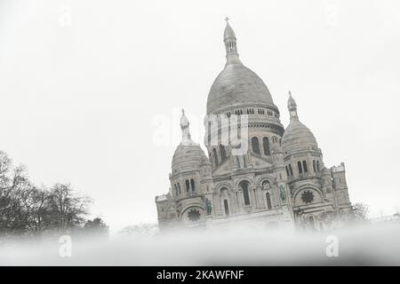 The domes of the basilica of the sacred hearth of Montmartre under snow in Paris, France, on 9 February 2018. (Photo by Julien Mattia/NurPhoto) Stock Photo