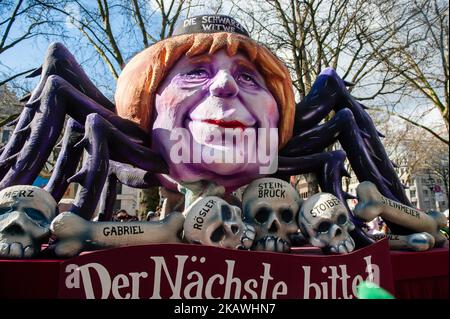 A float featuring German Chancellor and leader of the German Christian Democrats (CDU) Angela Merkel is seen during the annual Rose Monday parade on February 12, 2018 in Dusseldorf, Germany. Political satire is a traditional cornerstone of the annual parades. More than 30 music ensembles and 5,000 participants join the procession through the city. Elaborately built and decorated floats address cultural and political issues and can be satirical, hilarious and even controversial. The politically themed floats of satirist Jacques Tilly are famous the world over. (Photo by Romy Arroyo Fernandez/Nu Stock Photo
