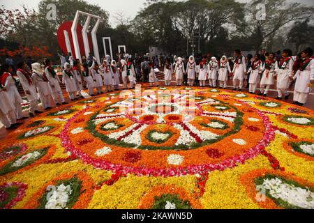 Bangladeshi girls decorates the Dhaka Central Shaheed Minar, or Martyr's Monuments on International Mother Language Day in Dhaka, Bangladesh, , Feb. 21, 2018. International Mother Language Day has been observed annually since 2000 to promote peace and multilingualism around the world and to protect all mother languages. It is observed on February 21 to recognize the 1952 Bengali Language Movement in Bangladesh.The Language Movement was a political movement in former East Bengal (today Bangladesh) advocating the recognition of the Bengali language as an official language of the then-Dominion o Stock Photo