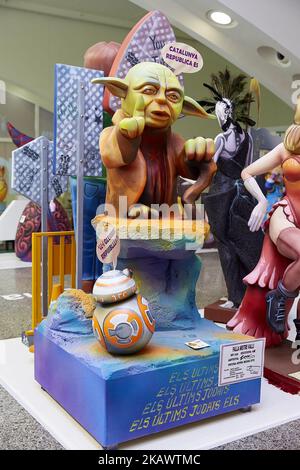 A 'ninot' (puppet) depicting Star Wars character Jedi Master Yoda is displayed during the Ninot exhibition ahead of Las Fallas Festival at Museo de Las Ciencias Principe Felipe on March 1, 2018 in Valencia, Spain. The Fallas is Valencias most international festival, which runs from March 15 until March 19 and celebrates the arrival of spring with fireworks, fiestas and bonfires made by large puppets named Ninots. During the months preceding this unique festivity, a lot of hard work and dedication is put into preparing the monumental and ephemeral cardboard statues that will be devoured by the  Stock Photo
