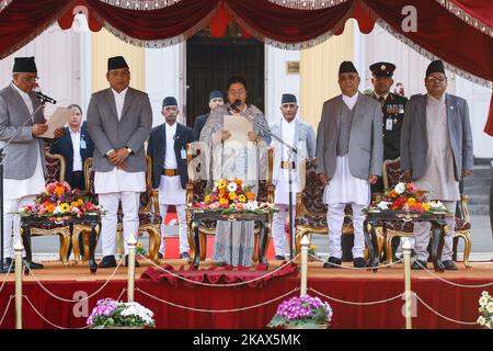 Nepal's President Bidhya Bhandari (C) takes her oath of office from Chief of Justice Gopal Parajuli (L) in presences of Vice President Nanda Kishor Pun (2-L), Prime Minister Khadga Prasad Oli (2-R) and speaker of the federal parliament Krishna Bahadur Mahara (R) during the ceremony at the presidential Residence in Kathmandu, Nepal, March 14, 2018. (Photo by Sunil Pradhan/NurPhoto) Stock Photo