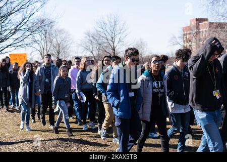 Students at Lane Technical High School in Chicago participate in a walkout to take a stand against school shootings and gun violence on March 14, 2018. Students across the U.S. participated in this 17 minute demonstration one month after the school shooting in Parkland, Florida. (Photo by Max Herman/NurPhoto) Stock Photo