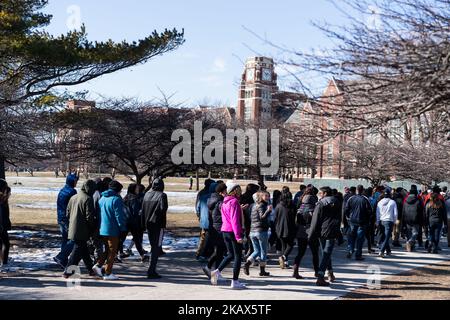 Students at Lane Technical High School in Chicago participate in a walkout to take a stand against school shootings and gun violence on March 14, 2018. Students across the U.S. participated in this 17 minute demonstration one month after the school shooting in Parkland, Florida. (Photo by Max Herman/NurPhoto) Stock Photo