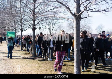 Students at Lane Technical High School in Chicago participate in a walkout to take a stand against school shootings and gun violence on March 14, 2018. Students across the U.S. participated in this 17 minute demonstration one month after the school shooting in Parkland, Florida. (Photo by Max Herman/NurPhoto) Stock Photo