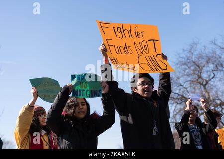 Students at Lane Technical High School in Chicago participate in a walkout to take a stand against school shootings and gun violence on March 14, 2018. Students across the U.S. participated in this 17 minute demonstration one month after the school shooting in Parkland, Florida. (Photo by Max Herman/NurPhoto) Stock Photo