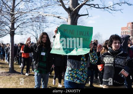 Students at Lane Technical High School in Chicago participate in a walkout to take a stand against school shootings and gun violence on March 14, 2018. Students across the U.S. participated in this 17 minute demonstration one month after the school shooting in Parkland, Florida. (Photo by Max Herman/NurPhoto) Stock Photo