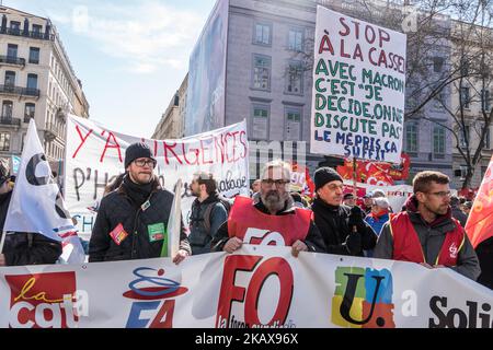 People take part in a demonstration to protest against French government's string of reforms, on March 22, 2018 in Lyon, southeasthern France. Seven trade unions have called on public sector workers to strike on March 22, including school and hospital staff, civil servants and air traffic controllers. More than 140 protests are planned across France, the biggest culminating at the Bastille monument in Paris where unions expect 25,000 demonstrators. (Photo by Nicolas Liponne/NurPhoto) Stock Photo