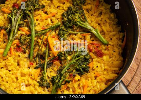 Goiânia, Goias, Brazil – October 27, 2022:  Closeup on a pan with vegetarian food made from brown rice with carrots and broccoli. Stock Photo