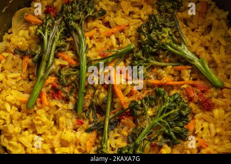 Goiânia, Goias, Brazil – October 27, 2022:  Closeup on a pan with vegetarian food made from brown rice with carrots and broccoli. Stock Photo