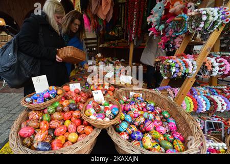 Hand made traditional hand painted Easter eggs (Polish: Pisanki) and baskets on display for sale on Krakow's Easter market. Originating as a pagan tradition, pisanki were absorbed by Christianity to become the traditional Easter egg. Pisanki are now considered to symbolise the revival of nature and the hope that Christians gain from faith in the resurrection of Jesus Christ. On Tuesday, 27 March 2018, in Rynek Square, Krakow, Poland. (Photo by Artur Widak/NurPhoto) Stock Photo