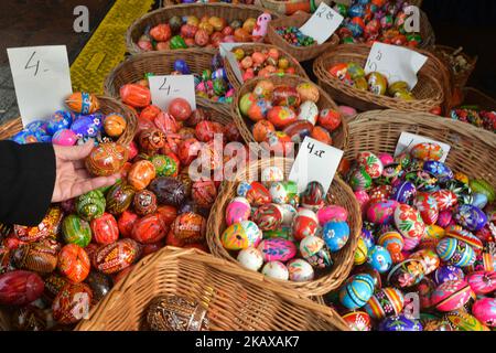 Hand made traditional hand painted Easter eggs (Polish: Pisanki) and baskets on display for sale on Krakow's Easter market. Originating as a pagan tradition, pisanki were absorbed by Christianity to become the traditional Easter egg. Pisanki are now considered to symbolise the revival of nature and the hope that Christians gain from faith in the resurrection of Jesus Christ. On Tuesday, 27 March 2018, in Rynek Square, Krakow, Poland. (Photo by Artur Widak/NurPhoto) Stock Photo