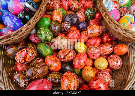 Hand made traditional hand painted Easter eggs (Polish: Pisanki) and baskets on display for sale on Krakow's Easter market. Originating as a pagan tradition, pisanki were absorbed by Christianity to become the traditional Easter egg. Pisanki are now considered to symbolise the revival of nature and the hope that Christians gain from faith in the resurrection of Jesus Christ. On Tuesday, 27 March 2018, in Rynek Square, Krakow, Poland. (Photo by Artur Widak/NurPhoto) Stock Photo