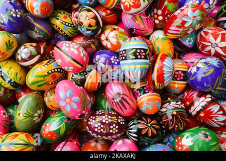 Hand made traditional hand painted Easter eggs (Polish: Pisanki) and baskets on display for sale on Krakow's Easter market. Originating as a pagan tradition, pisanki were absorbed by Christianity to become the traditional Easter egg. Pisanki are now considered to symbolise the revival of nature and the hope that Christians gain from faith in the resurrection of Jesus Christ. On Tuesday, 27 March 2018, in Rynek Square, Krakow, Poland. (Photo by Artur Widak/NurPhoto) Stock Photo