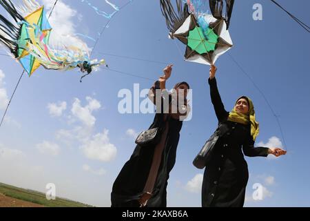 A Palestinian woman flies a kite during a demonstration ahead of the Land Day, at a tent city along the border with Israel east of Gaza City on March 29, 2018. Land Day marks the killing of six Arab Israelis during 1976 demonstrations against Israeli confiscations of Arab land.(Photo by Momen Faiz/NurPhoto) Stock Photo