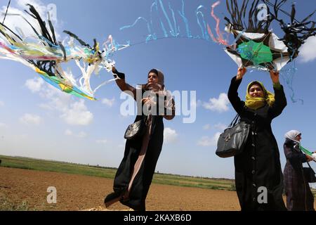 A Palestinian woman flies a kite during a demonstration ahead of the Land Day, at a tent city along the border with Israel east of Gaza City on March 29, 2018. Land Day marks the killing of six Arab Israelis during 1976 demonstrations against Israeli confiscations of Arab land.(Photo by Momen Faiz/NurPhoto) Stock Photo