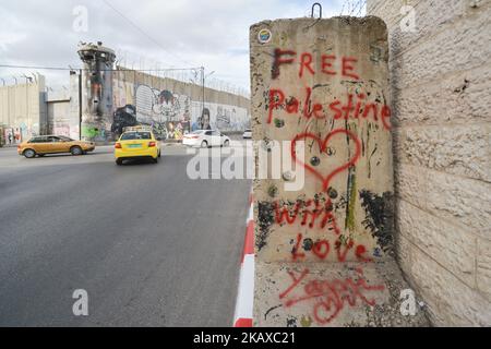 Political and social mural paintings and graffitis on the Israeli West Bank barrier in Bethlehem, West Bank on March 13, 2018. (Photo by Artur Widak/NurPhoto) Stock Photo