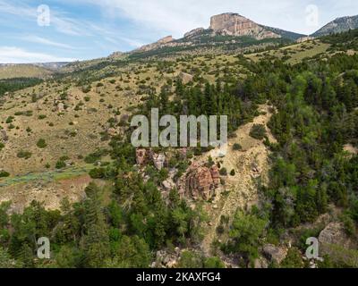 Rocky cliff and Shell Creek, Shell Canyon, Bighorn National Forest, Wyoming, USA, July 2019 Stock Photo