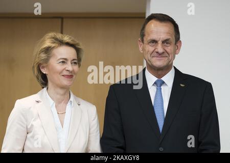 German Defence Minister Ursula von der Leyen (L) and President of the German Olympic Sports Confederation (DOSB) Alfons Hoermann (R) are pictured during a ceremony to honour the members of the Bundeswehr who attended the Winter Olympic Games in Pyeongchang at the Ministry of Defence in Berlin, Germany on April 12, 2018. (Photo by Emmanuele Contini/NurPhoto) Stock Photo
