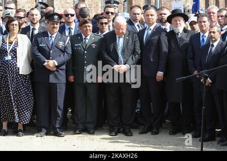 Reuven Rivlin President of Israel and Andrzej Duda President of Poland are seen in Auschwitz I Death Camp in Oswiecim, Poland on 12 April 2018 Taking place annually on Yom Hashoah - Holocaust Remembrance Day - The March of the Living itself is a 3-kilometer walk from Auschwitz to Birkenau as a tribute to all victims of the Holocaust. (Photo by Michal Fludra/NurPhoto) Stock Photo