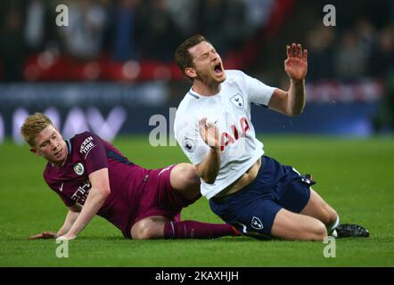 Tottenham Hotspur's Jan Vertonghen gets tackle by Manchester City's Kevin De Bruyne during the Premiership League match between Tottenham Hotspur and Manchester City at Wembley Stadium in London, England on April 14, 2018. (Photo by Kieran Galvin/NurPhoto)  Stock Photo