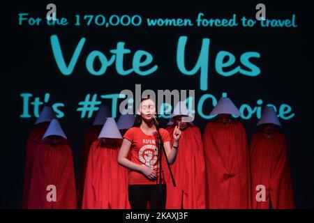 Natalya O'Flaherty spoken word artist and ROSA activists dressed as 'Handmaids' during a Rally for Equality, Freedom & Choice organised by ROSA - an Irish Socialist Feminist Movement at Liberty Hall in Dublin, Ireland on April 14, 2018. (Photo by Artur Widak/NurPhoto) Stock Photo