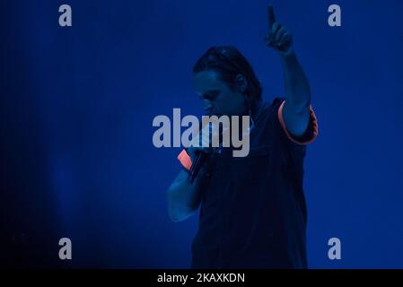 Canadian indie rock band Arcade FIre is pictured on atage as they perform at Arena Wembley, London on April 12, 2018. Arcade Fire is a Canadian indie rock band, consisting of husband and wife Win Butler (vocals, bass, guitar) and Régine Chassagne, along with Win's younger brother William Butler, Richard Reed Parry, Tim Kingsbury and Jeremy Gara. The band's current touring line-up also includes former core member Sarah Neufeld, percussionist Tiwill Duprate and saxophonist Stuart Bogie. (Photo by Alberto Pezzali/NurPhoto) Stock Photo