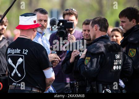 Thorsten Heise the organizer of the festival talks to the police outside the venue of the 'Schild und Schwert' (Shield and Sword) neo-nazi festival, in the small eastern German town of Ostritz on April 20, 2018. Hundreds of neo-Nazis were expected to congregate on April 20, 2018, which marks Adolf Hitler's birthday, and April 21, 2018 for a two-day festival in Ostritz, where anti-fascist groups have vowed counter-protests. (Photo by David Speier/NurPhoto) Stock Photo