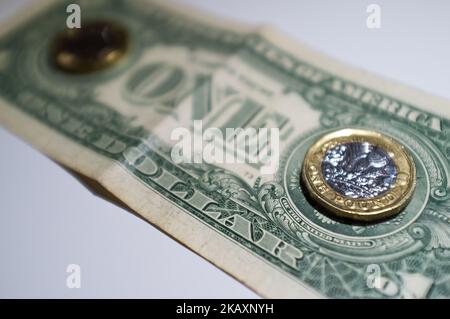 U.S. dollar and British Pound bank notes and are photographed in London on April 29, 2018. The U.S. benchmark government bond yield broke through the psychologically significant 3 percent level for the first time in more than four years. (Photo by NurPhoto) Stock Photo