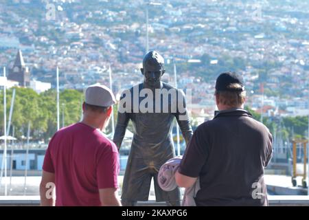 A general view of Cristiano Ronaldo statue in front of the CR7 Museum located in Funchal seafront, on the island of Madeira, where Portuguese football star grew up and played for amateur team Andorinha from 1992 to 1995. The museum is dedicated to Ronaldo's Real Madrid and Portugal national team achievements and successes during his carrer to date. On Thursday, April 26, 2018, in Funchal, Madeira Island, Portugal. (Photo by Artur Widak/NurPhoto)  Stock Photo