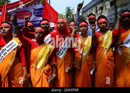 Bangladeshi garment workers and other labor organization members take part in a rally to mark May Day, International Workers' Day in Dhaka, Bangladesh on May 01, 2018. (Photo by Mamunur Rashid/NurPhoto) Stock Photo