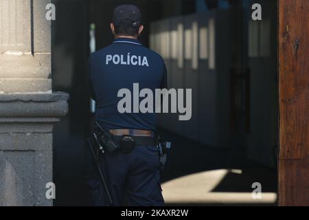 A member of local Police forces seen at the entrance to Funchal Town Hall. On Monday, April 23, 2018, in Funchal, Madeira Island, Portugal. (Photo by Artur Widak/NurPhoto)  Stock Photo