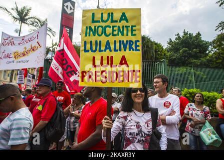 Supporters of the Workers' Party founder and Brazilian ex-president (2003-2011) Luiz Inacio Lula da Silva take part in a May Day rally at República square in São Paulo, Brazil, on May 1, 2018. - Brazilian prosecutors have filed new graft charges against imprisoned Workers' Party founder and ex-president Luiz Inacio Lula da Silva on April 30, as well as the party's current chief. Lula and Senator Gleisi Hoffmann, along with former Lula government ministers Antonio Palocci and Paulo Bernardo, allegedly were promised $40 million by corruption-riddled construction giant Odebrecht, the prosecutor's Stock Photo