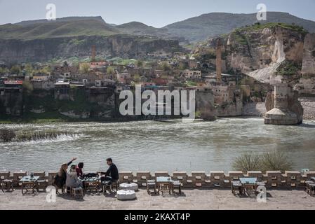 Tourists balk at destruction in Hasankeyf, an ancient city on the banks of Tigris River in southeast Turkey, will soon be flooded by the Ilisu Dam. Picture here, construction crews destroy limestone cliffs dotted with neolithic caves and pulverize a world heritage site to prep the area for submerging later this summer. Photo taken 22 March 2018. (Photo by Diego Cupolo/NurPhoto) Stock Photo