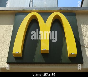The logo of the American fast food company McDonald's, founded in 1940 as a restaurant operated by Richard and Maurice McDonald, in San Bernardino, California, United States is seen in Munich. (Photo by Alexander Pohl/NurPhoto) Stock Photo
